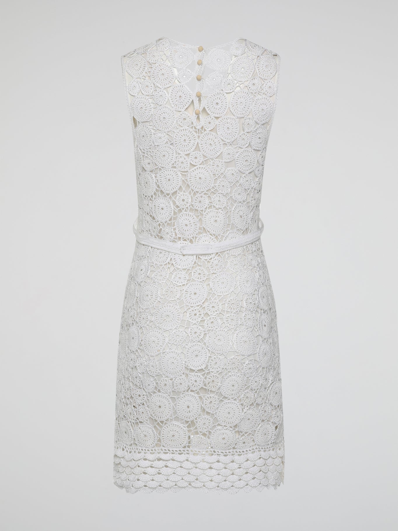 Step into the world of exquisite elegance with this captivating White Crochet Dress by Roberto Cavalli. Crafted with meticulous attention to detail, this dress channels the essence of femininity, showcasing delicate crochet patterns that gracefully embrace your silhouette. Whether you're attending a garden soiree or a beachfront dinner, this dress effortlessly combines timeless charm with modern flair, making you the epitome of effortless beauty.