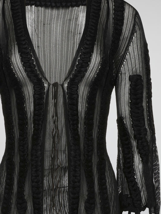 Wrap yourself in luxurious style with the Roberto Cavalli Black Mesh Cardigan. Made from lightweight, breathable mesh fabric, this cardigan is perfect for layering year-round. The intricate black mesh design adds a touch of edgy sophistication to any outfit.