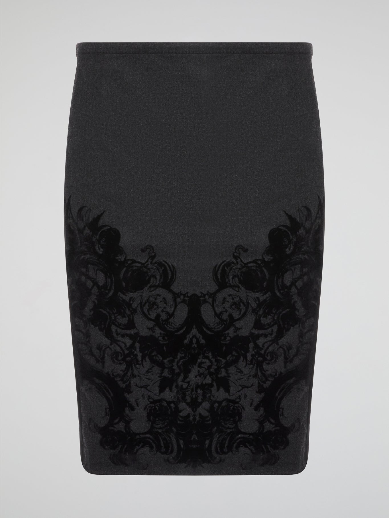 Elevate your office attire with this stunning grey printed pencil skirt from iconic designer Roberto Cavalli. The intricate pattern adds a touch of sophistication and style, making you stand out from the crowd. Pair it with a crisp white blouse and heels for a polished and fashion-forward look that will turn heads wherever you go.