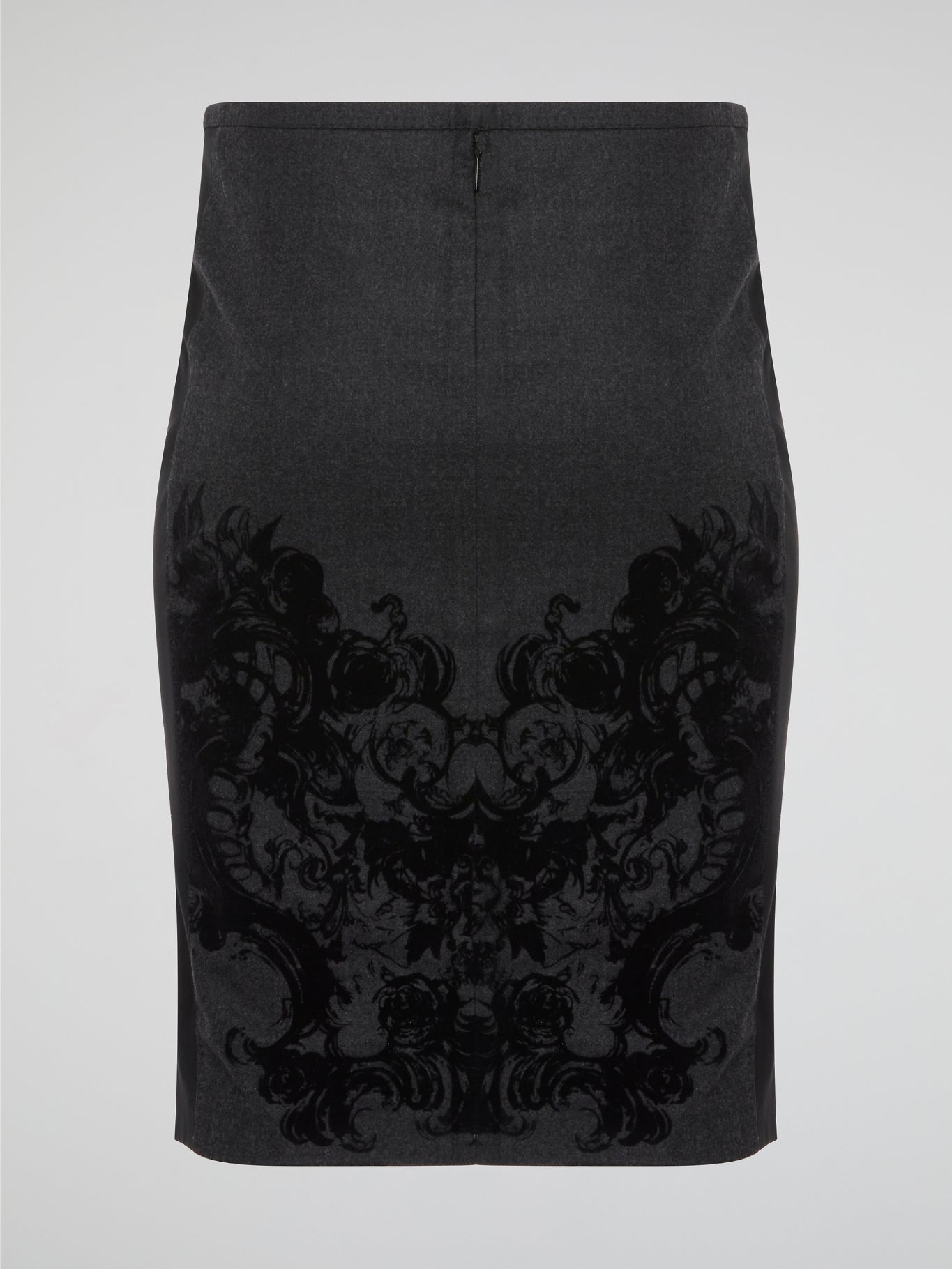 Elevate your office attire with this stunning grey printed pencil skirt from iconic designer Roberto Cavalli. The intricate pattern adds a touch of sophistication and style, making you stand out from the crowd. Pair it with a crisp white blouse and heels for a polished and fashion-forward look that will turn heads wherever you go.