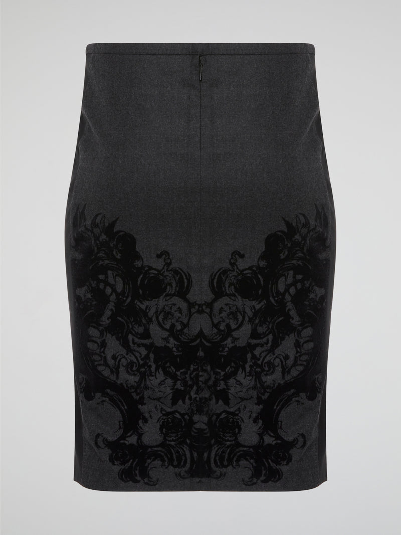 Elevate your office attire with this stunning grey printed pencil skirt from iconic designer Roberto Cavalli. The intricate pattern adds a touch of sophistication and style, making you stand out from the crowd. Pair it with a crisp white blouse and heels for a polished and fashion-forward look that will turn heads wherever you go.
