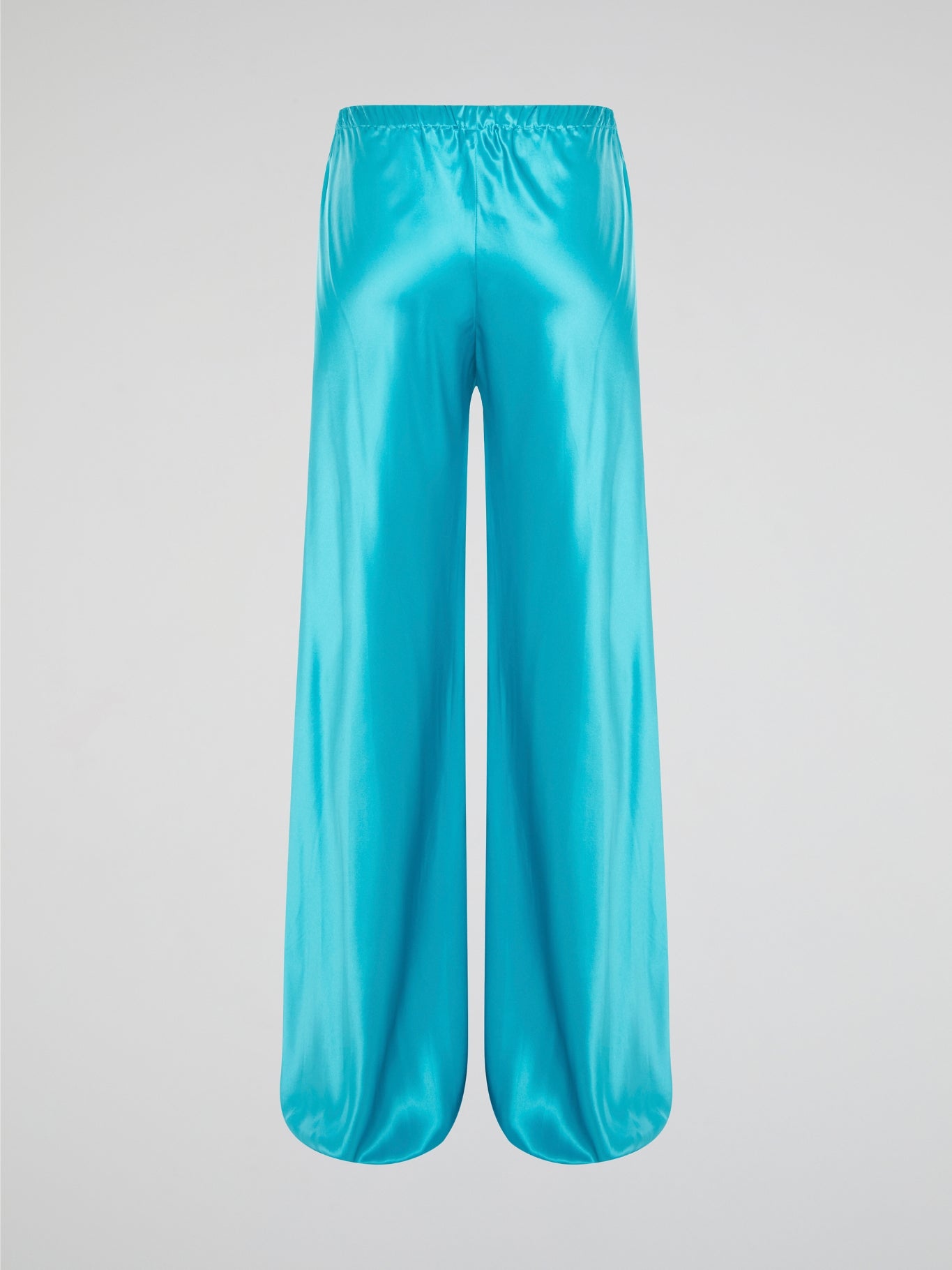Step up your style game with these luxurious blue silk pants by Roberto Cavalli. The drawstring waist adds a casual and comfortable touch to the elegant silk fabric, making them perfect for any occasion. Stand out from the crowd and make a statement with these unique and eye-catching pants.