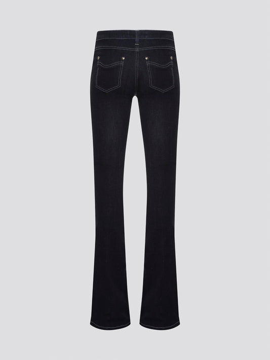 Step out in style with these Roberto Cavalli Black Contrast Stitch Flared Jeans, a modern twist on a classic silhouette. The contrast stitching adds a touch of edge to these sleek black jeans, making them a wardrobe staple for any fashion-forward individual. Pair them with a simple white t-shirt and heels for a chic and sophisticated look that will turn heads wherever you go.