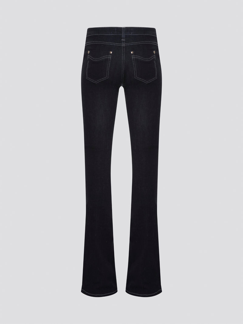 Step out in style with these Roberto Cavalli Black Contrast Stitch Flared Jeans, a modern twist on a classic silhouette. The contrast stitching adds a touch of edge to these sleek black jeans, making them a wardrobe staple for any fashion-forward individual. Pair them with a simple white t-shirt and heels for a chic and sophisticated look that will turn heads wherever you go.