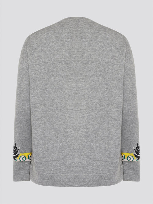 Elevate your casual wardrobe with this effortlessly chic Grey Embroidered Sweatshirt from Roberto Cavalli. Crafted with intricate floral embroidery, this sweatshirt adds a touch of luxury to your everyday look. Pair it with jeans for a stylish and comfortable outfit that will turn heads wherever you go.