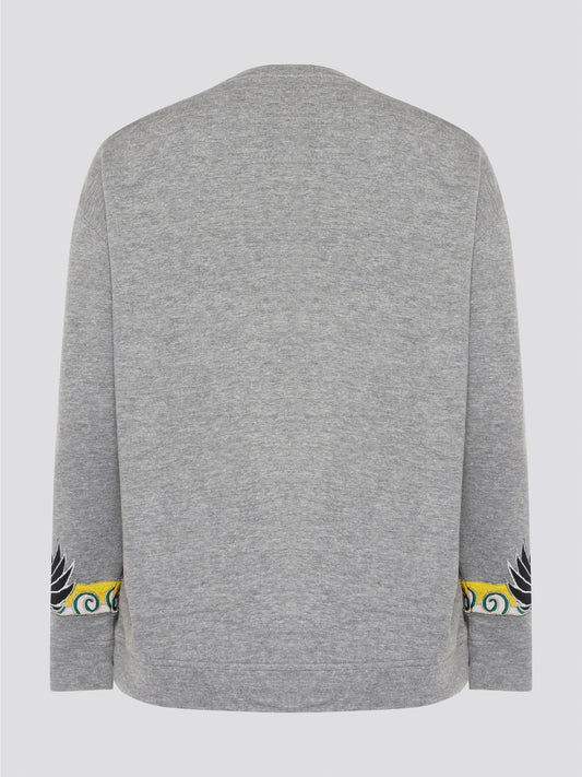 Elevate your casual wardrobe with this effortlessly chic Grey Embroidered Sweatshirt from Roberto Cavalli. Crafted with intricate floral embroidery, this sweatshirt adds a touch of luxury to your everyday look. Pair it with jeans for a stylish and comfortable outfit that will turn heads wherever you go.