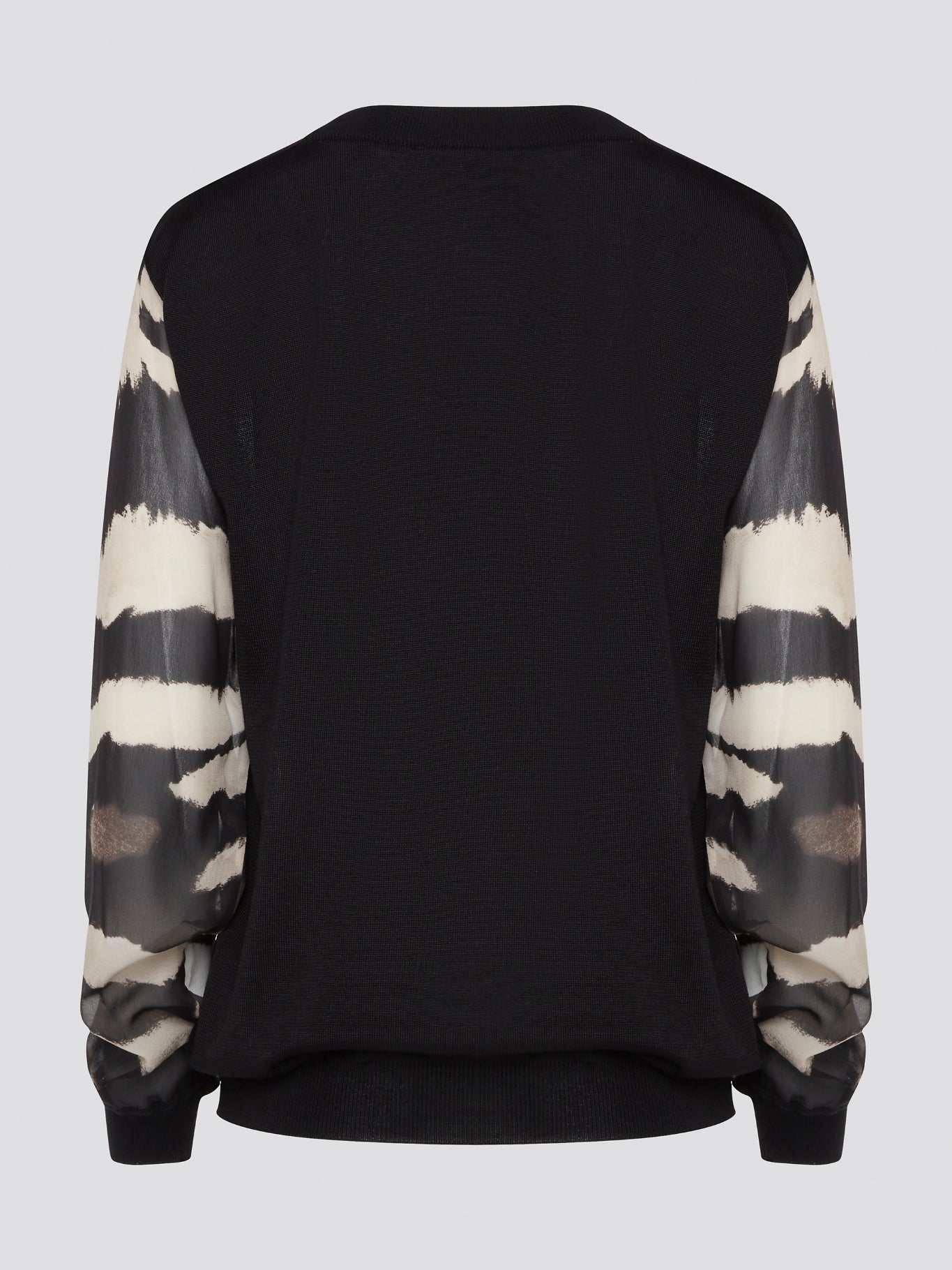 Make a fierce fashion statement with the Roberto Cavalli Zebra Print Sweatshirt, featuring a bold and eye-catching zebra print design. Crafted from premium materials, this sweatshirt offers both style and comfort for all-day wear. Elevate your street style with this standout piece that is sure to turn heads wherever you go.